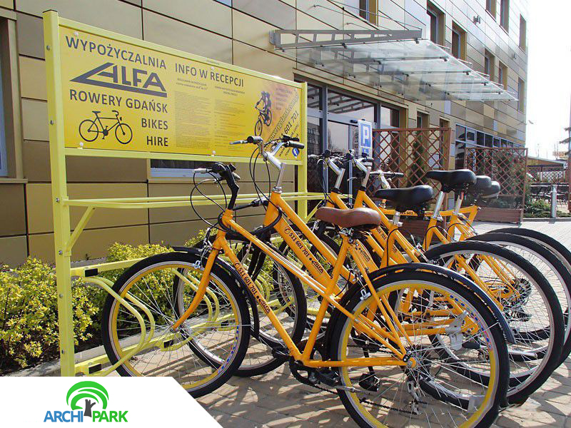 Stojak rowery KARAT VERTICAL PREMIUM na 5 rowerów z Reklamą | z regulowanymi stanowiskami | w kolorze żółtym